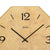 Wall clock dial: beige print with large 12 and black hands in a wooden frame.