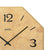 Wall clock detail: beige printed dial with 12 and black hands in a wooden frame.
