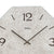 Wall clock dial with large numerals, black hands, and AMS lettering