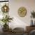 Wall clock on the wall: wood-look dial, metal numerals, anthracite hands