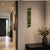 Wall clock in wall design: wooden case with moss inlay, white circle and hands