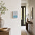 Wall clock on the wall with analog time display and digital display for temperature and humidity