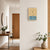 Wall clock on the wall with wood-look housing and blue LCD display