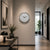 Round wall clock with white dial, black hands, and silver metal rim