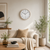Wall clock with beige frame and white dial with black numbers