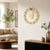 Brass wall clock with 3D dial and gold hour markers