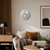 Round LED word clock with gray dial on beige-toned background
