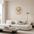Round wooden wall clock on the wall: gold-colored dial ring with line markers, black hands