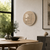 Round LED word clock in wood look on wall with illuminated text