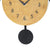 Close-up of the dial and pendulum weight of the cuckoo clock, with blue numerals and a gold background