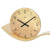 Table clock dial: black hands, A.M.S. logo, and curved wood base in brass look