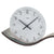 Table clock, close-up of round dial with black hands and numerals