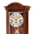 Antike Wanduhr mit Zifferblatt, AMS-Logo und Pendel im Kirschbaumgehäuse