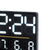 Close-up of an LED display on a digital clock, black, showing time and temperature/humidity.
