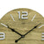 Close-up of wall clock: wood-look dial with metal numerals, anthracite hands