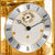 Close-up of the table clock: round dial with Roman numerals and hands