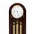 Grandfather clock dial with Roman hour markers and gold-colored chime rods in the case