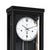 Wall clock dial with black hands, indices at 12 and 6, and metal pendulum