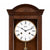 Wooden wall clock with large dial, Roman numerals, and gold pendulum rod