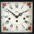 Front view of the table clock: white dial with Roman numerals and floral border