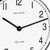 Table clock dial with white surfaces, black hands, and Hermle lettering