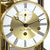 Close-up of mahogany mantel clock: gold dial with Roman numerals