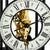 Close-up of the gold-colored movement of a mechanical skeleton table clock