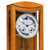 Wall clock front with large dial, moon motif, and four metal pendulums in a wooden case