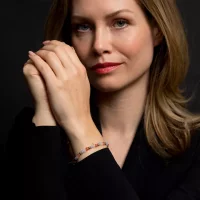 Bracelet made of gemstones in purple, pink, and gold with...