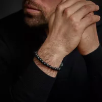 Bracelet made of 8mm black gemstones with black steel...